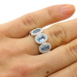 0.57CTS DIAMOND RING WITH OVAL BLUE GEM STONES OF 4.20 CTS SET IN 14K WHITE GOLD