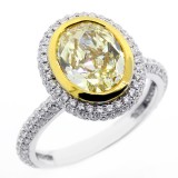 3.98 CTS OVAL FANCY YELLOW DIAMOND ENGAGEMENT RING SET IN 18K WHITE GOLD