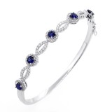 0.93 Cts Sapphire and Diamond Halo Bracelet set in 18K white gold 