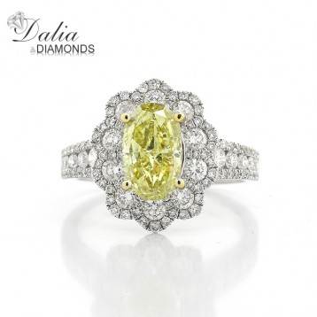 3.32 Cts Oval Cut Yellow Diamond Ring with Flower Shape halo set in 18K White Gold