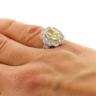 3.32 Cts Oval Cut Yellow Diamond Ring with Flower Shape halo set in 18K White Gold