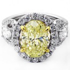 4.73 Cts Fansy Yellow Oval cut Engagement Ring set in 18K White Gold