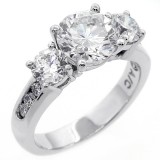 Three stone round cut diamond engagement ring set in 14 K white gold