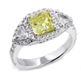 Fancy Yellow Cushion Cut Three Stone ring set in 18K White Gold