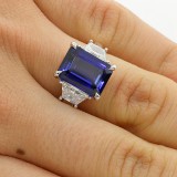 1.08 CTS TRAPEZ CUT DIAMOND RING WITH 5.38 CTS JADORE EMERALD CUT SET IN PLATINUM